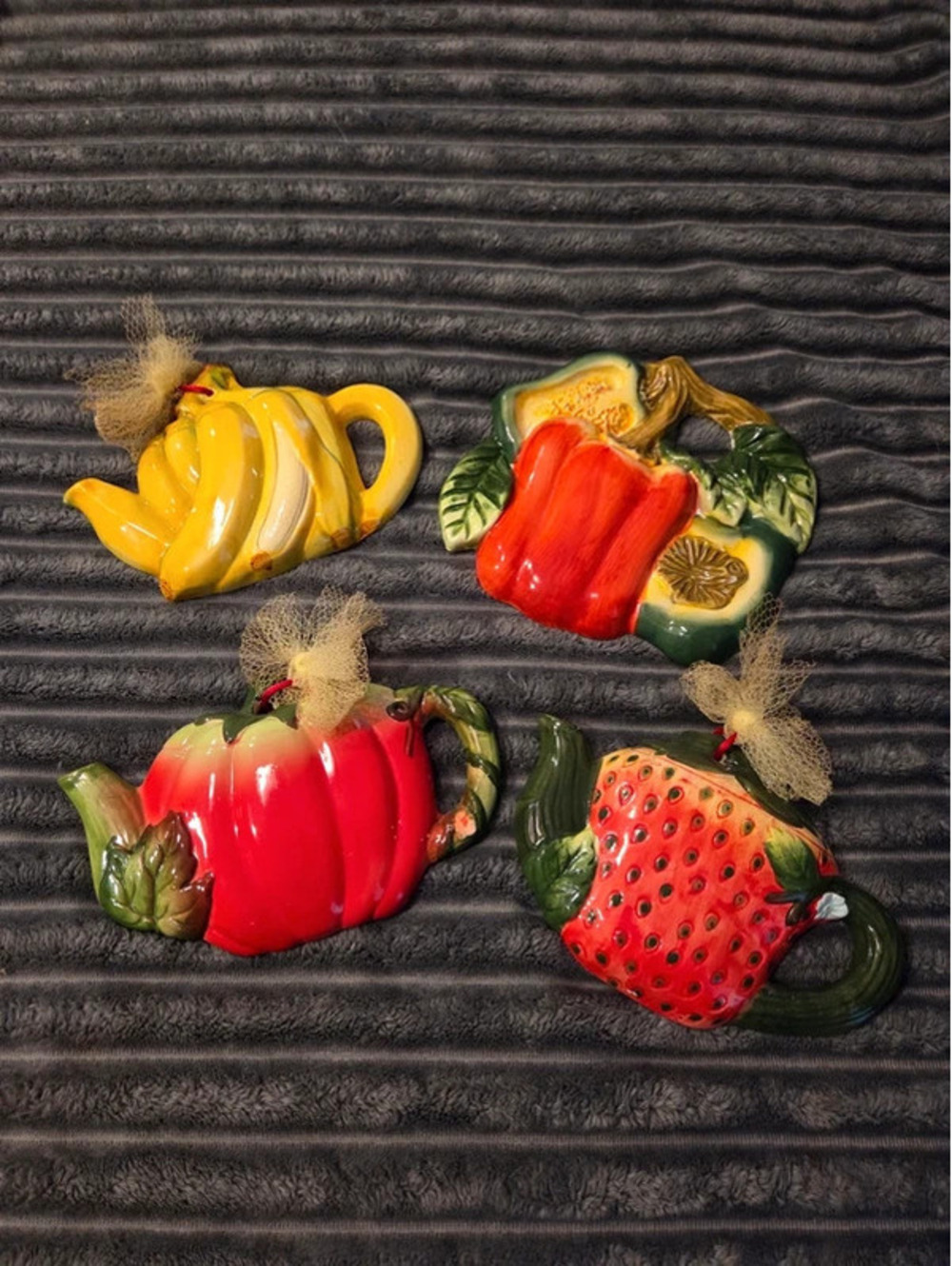 Set of four vintage ceramic fruit and vegetable teapot wall plaques
